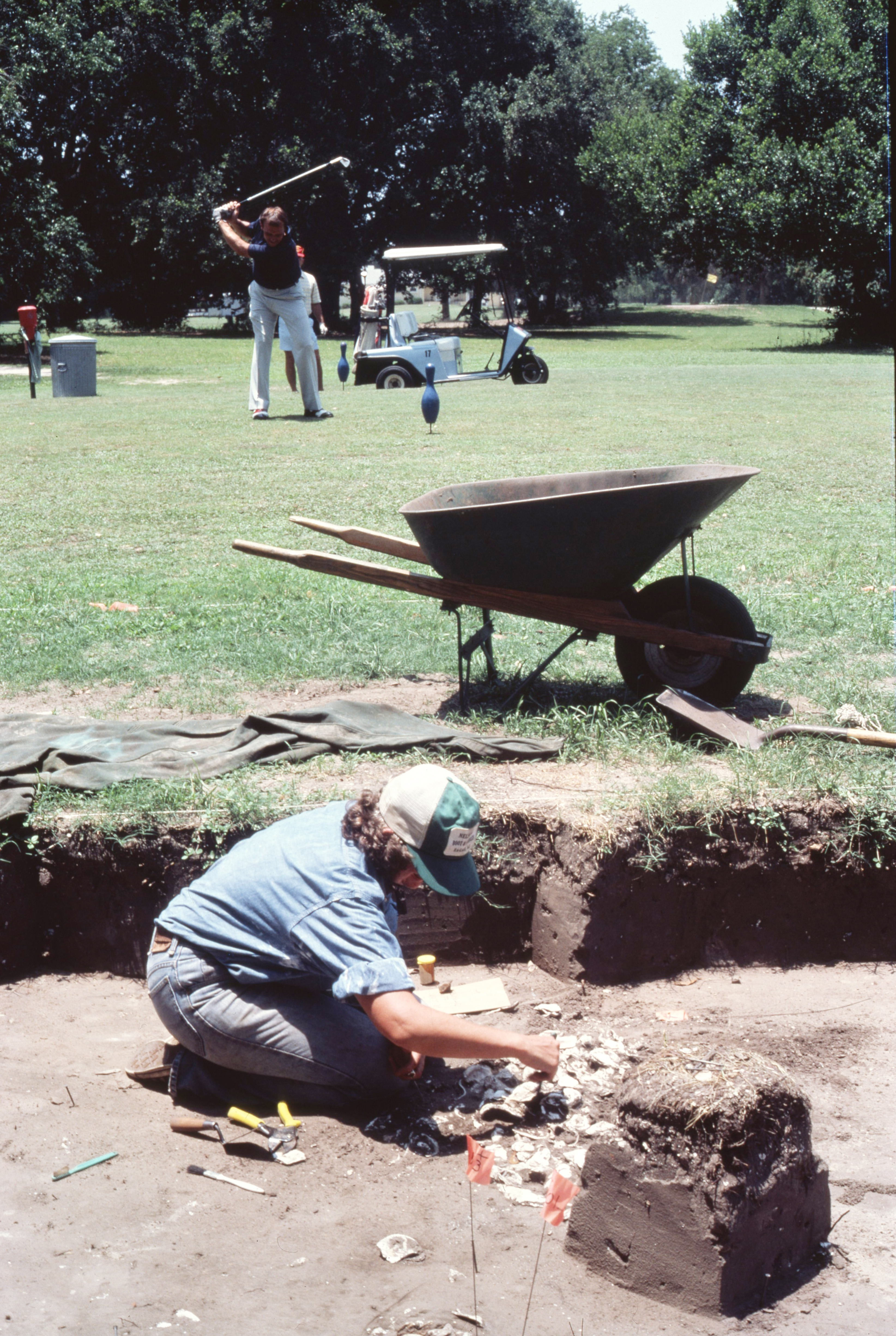 An archaeologist digs at the site of Santa Elena as golf continues at Marine Corps Recruit Depot Parris Island in the 1980s. Parris Island Museum